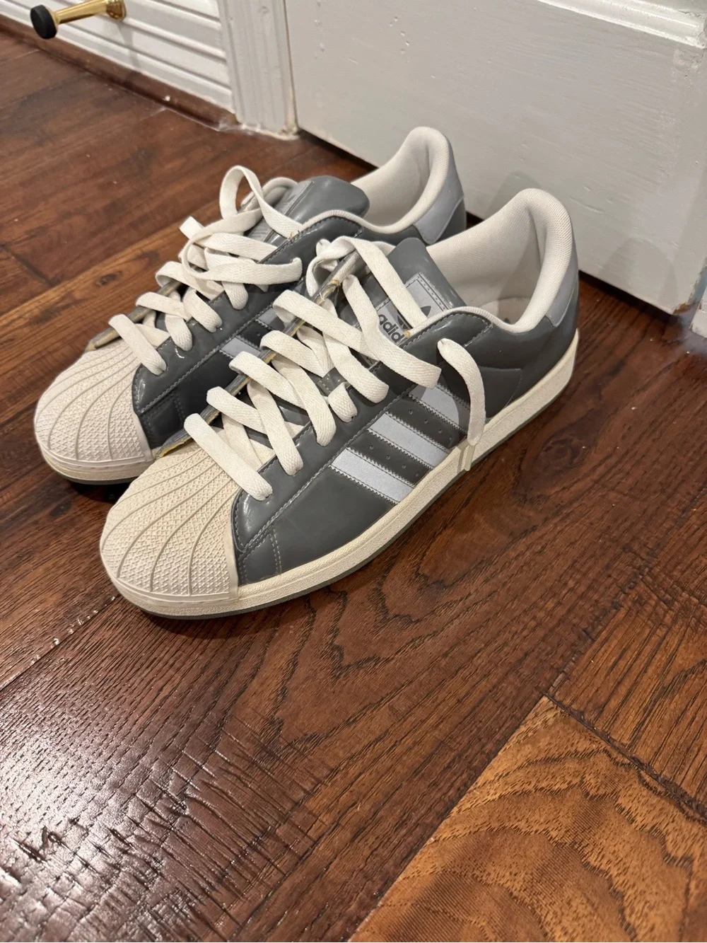 adidas Men’s Gray and White Shell Toe Sneakers